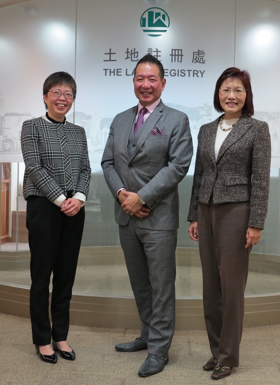 The Land Registrar, Ms. Doris CHEUNG, JP (right), Director of Titles for the Province of Ontario, Mr Jeffrey LEM (centre) and the Registry Manager, Mrs. Amy FONG, JP (left)