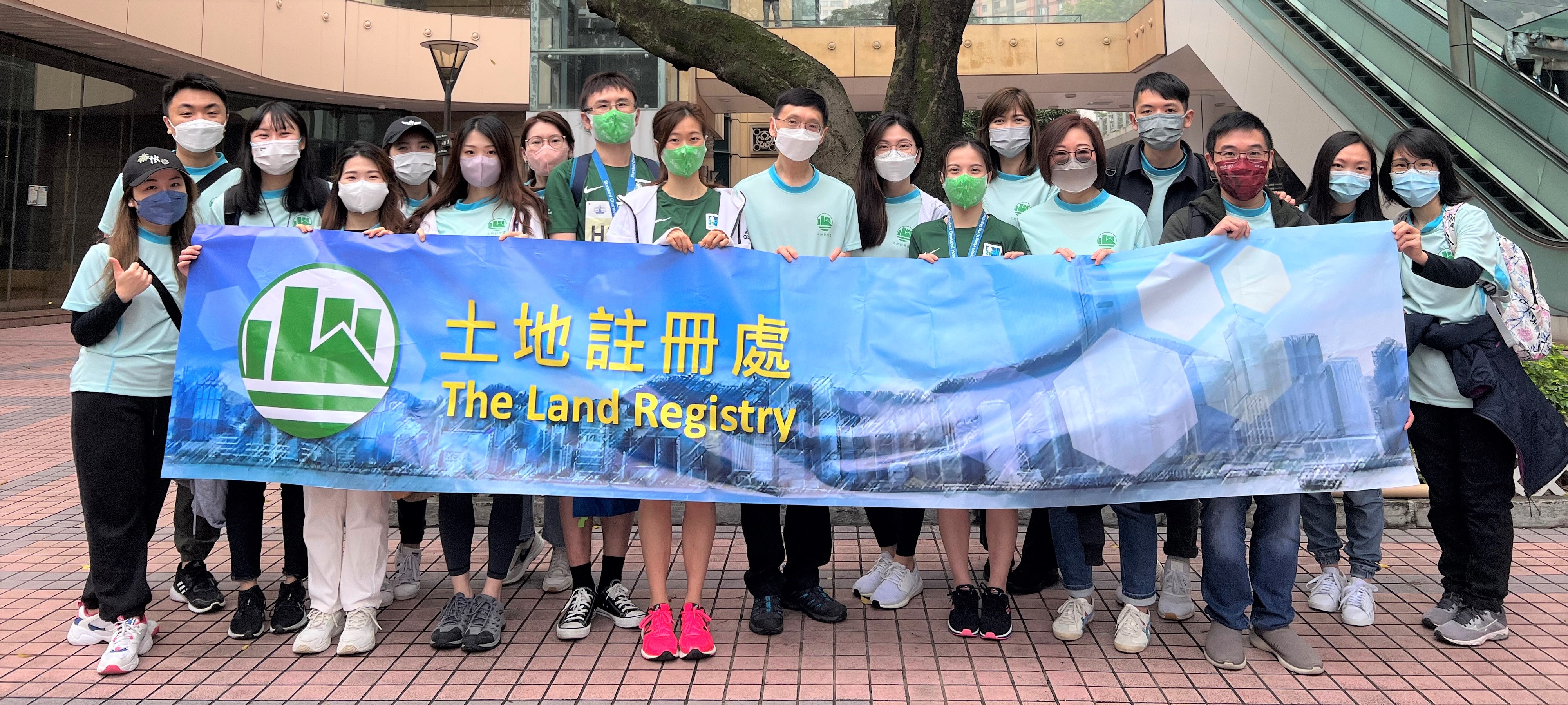 The Registry Manager, Mr KF PANG (centre), the runners and the cheering team celebrated the completion of the race